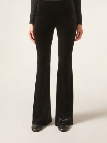 CALZEDONIA Flared Pants in Black: front