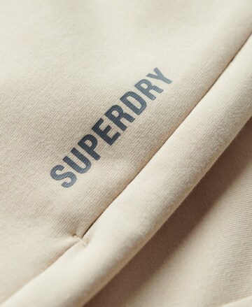 Coupe slim Pantalon de sport Superdry en beige
