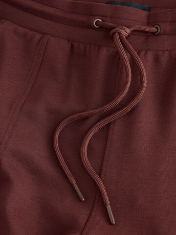 Wide leg Pantaloni funzionali di Next in rosso