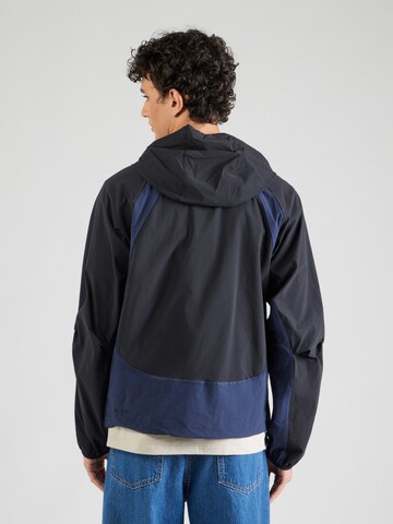 Nike Sportswear - Chaqueta funcional 'Windrunner' en negro