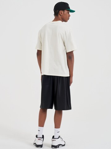 AND1 Paita 'Did You Dirty Trash Talk' värissä beige