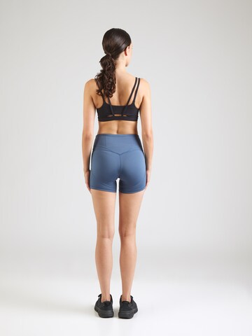 Skinny Pantalon de sport 'Shape' PUMA en bleu