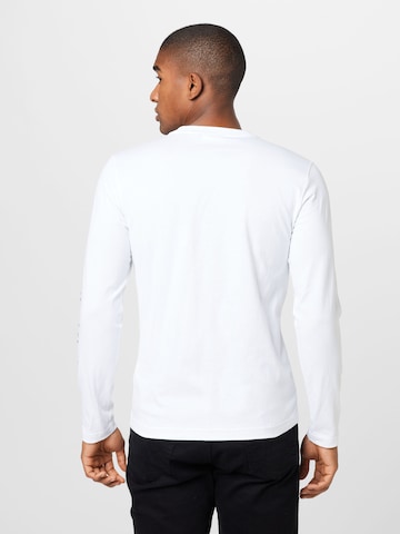 Calvin Klein قميص بلون أبيض