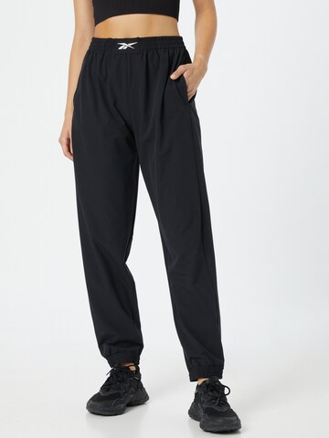 Reebok Tapered Sports trousers in Black: front