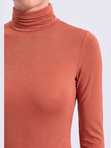 Maglietta intima 'Body Dolcevita Manica Lunga in Cashmere e Modal' di Ciocca in arancione