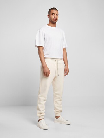 Tapered Pantaloni di Urban Classics in beige