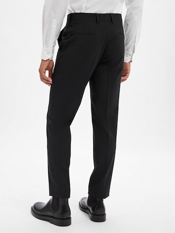 Regular Pantalon à plis 'Leon' BOSS en noir