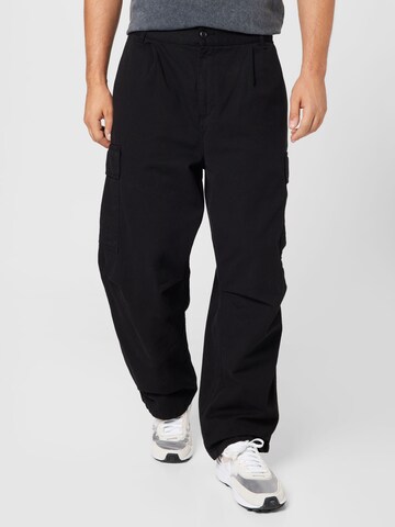 Carhartt WIP Loose fit Cargo Pants 'Cole' in Black: front