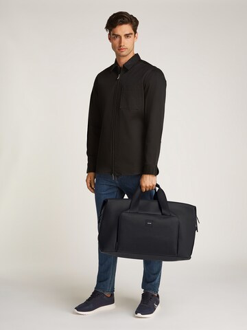 Calvin Klein Cestovní taška 'Essential' – černá
