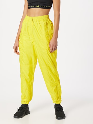 Tapered Pantaloni sport 'Lined Winter' de la ADIDAS BY STELLA MCCARTNEY pe galben: față