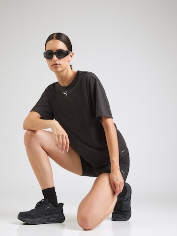 PUMA Funktionstopp 'TAD ESSENTIAL' i svart