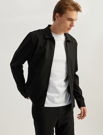 Koton Zip-Up Hoodie in Black: front