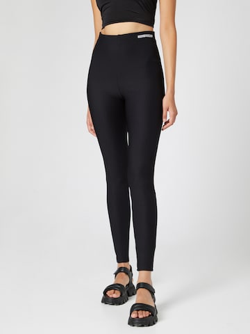 Hoermanseder x About You Skinny Leggings 'May' in Black: front