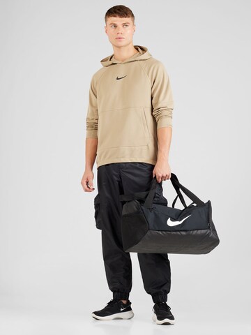 Effilé Pantalon cargo Nike Sportswear en noir