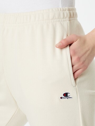 Tapered Pantaloni di Champion Authentic Athletic Apparel in giallo