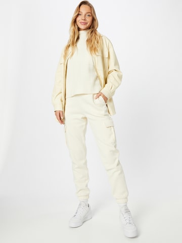 Effilé Pantalon cargo Urban Classics en beige