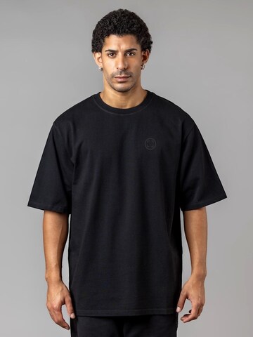 UNORGANIZED BRAND - Camiseta 'SCHWERES OVERSIZE T5' en negro: frente
