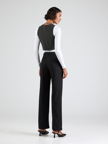 Wide leg Pantaloni con piega frontale di REMAIN in nero