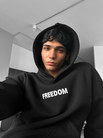 Sweat-shirt 'Oversize Stitches Hoodie - Black' Kleidermafia en noir