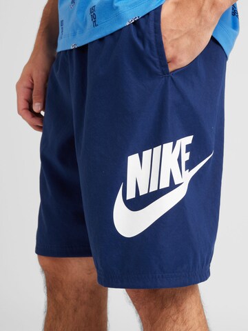 Nike Sportswear Loose fit Pants 'CLUB' in Blue