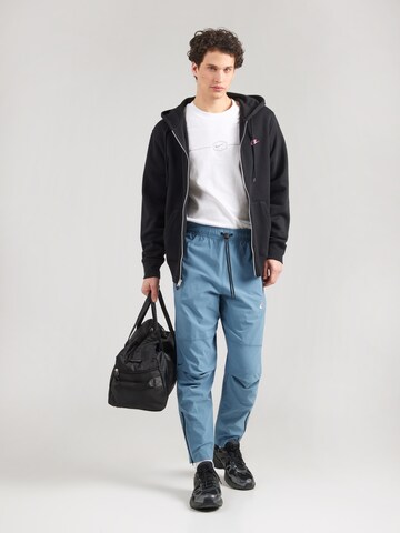 zils Nike Sportswear Pakapēniski sašaurināts piegriezums Bikses