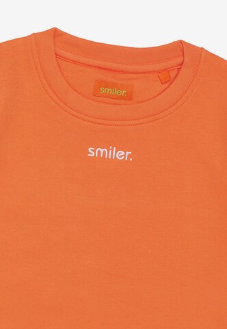 smiler. Sweatshirt in Orange