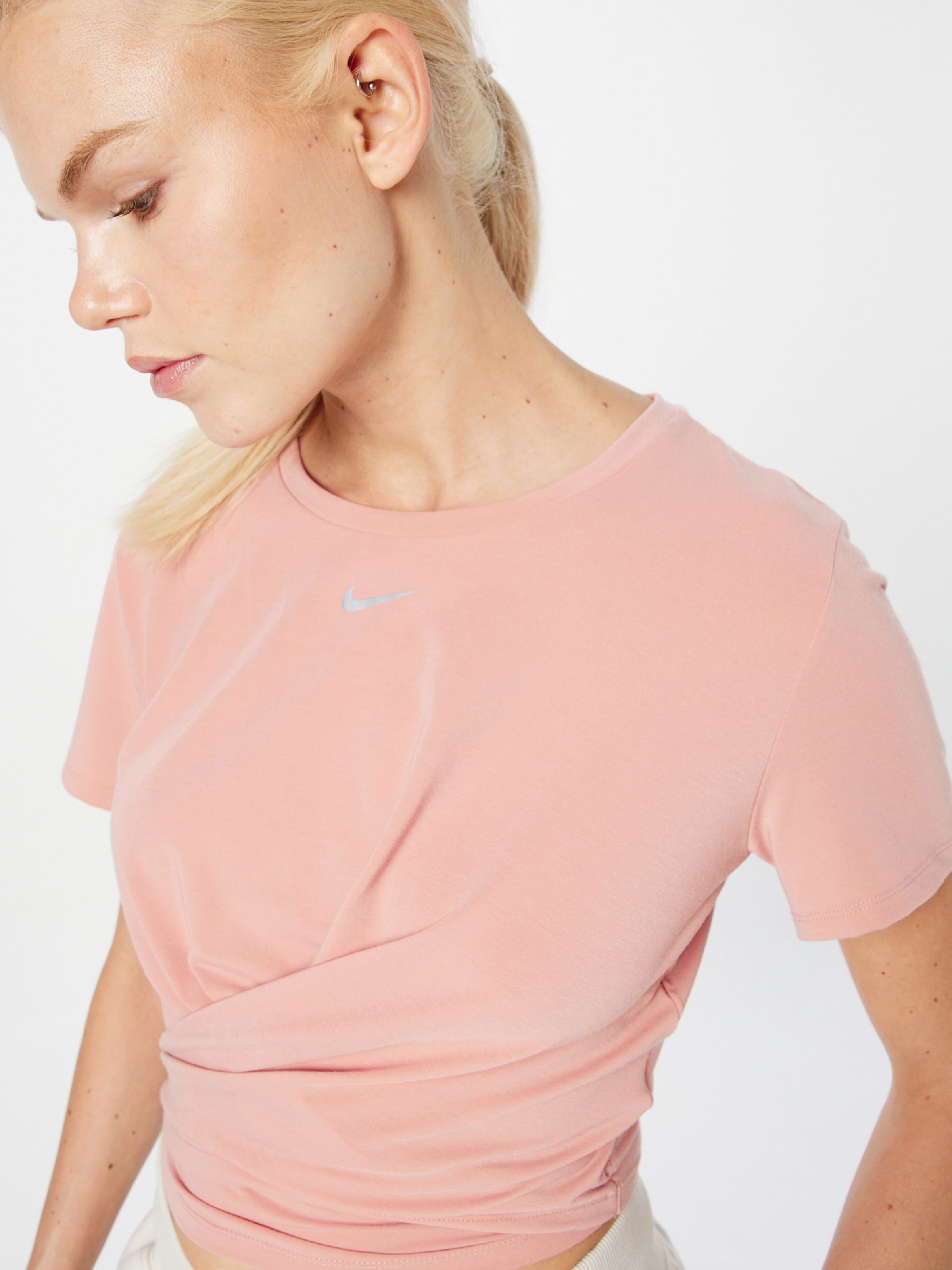 NIKE Performance shirt in Pastel Red ABOUT YOU
