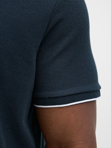 Jack & Jones Plus Poloshirt 'JJEAustin' in Schwarz
