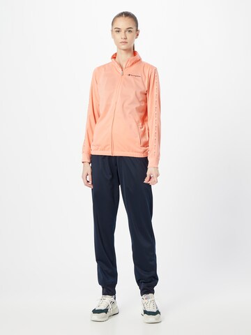 Champion Authentic Athletic Apparel Tracksuit in Orange: front