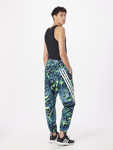 ADIDAS SPORTSWEAR Zúžený Sportovní kalhoty 'Future Icons Allover Print' – modrá