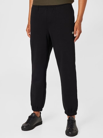 Lacoste Sport Tapered Workout Pants in Black: front