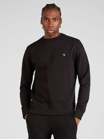 Sweat-shirt Calvin Klein Jeans en noir : devant