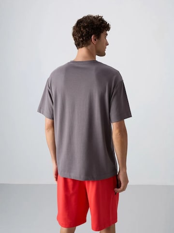 Maglietta di Tommy Life in grigio