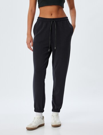 Koton Regular Trousers in Black: front