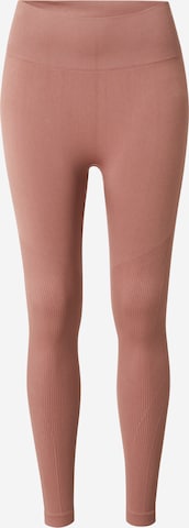 Athlecia Skinny Spodnie sportowe 'Okalia' w kolorze brązowy: przód