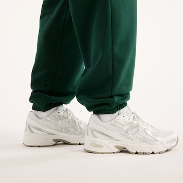 new balance Tapered Broek 'Sport Essentials French Terry Jogger' in Groen