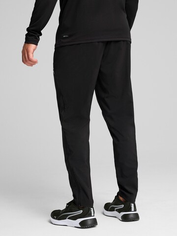 PUMA - Tapered Pantalón deportivo 'TAD Essentials' en negro