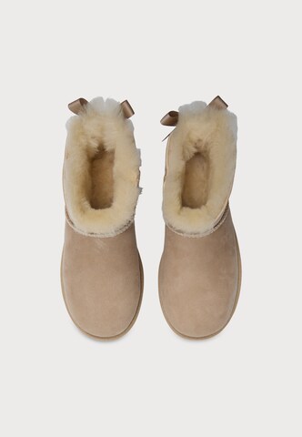 bēšs UGG Klasiski zābaki 'Ultra Mini Bailey Bow'