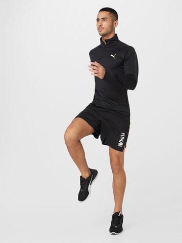 Regular Pantaloni sport de la PUMA pe negru