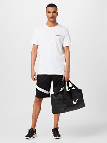 NIKE Regular Sports trousers in Black