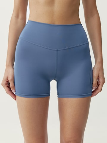 Born Living Yoga Skinny Workout Pants 'Volea' in Blue: front