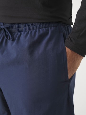 Loosefit Pantalon de sport new balance en bleu