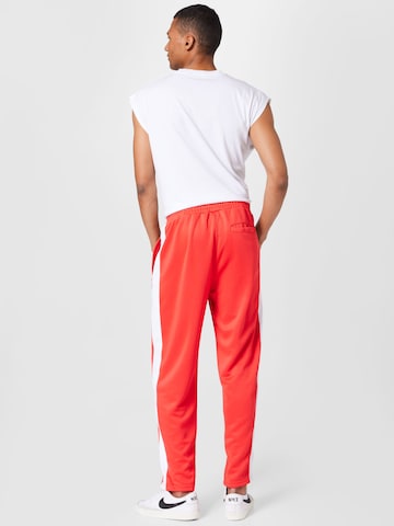 regular Pantaloni di Karl Kani in rosso