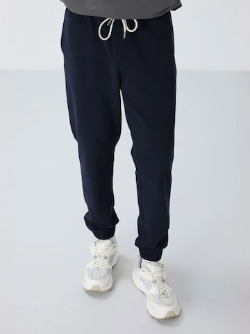 Tommy Life Tapered Workout Pants 'Jogginghose' in Blue: front
