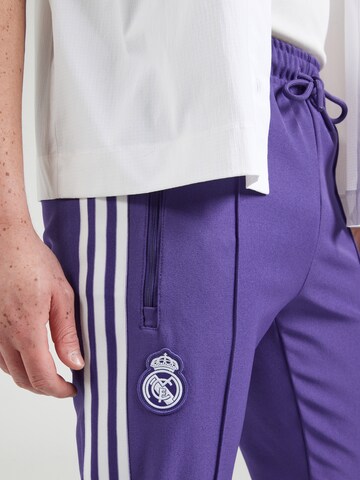 ADIDAS PERFORMANCE Zwężany krój Spodnie sportowe w kolorze fioletowy