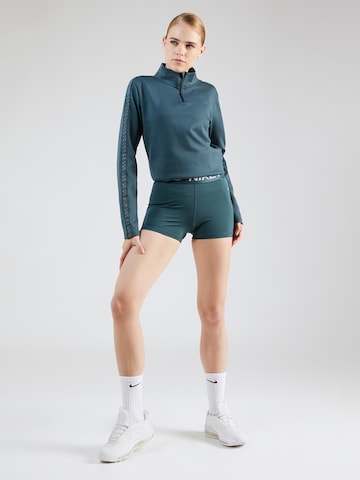 NIKE Skinny Spodnie sportowe 'Pro' w kolorze zielony