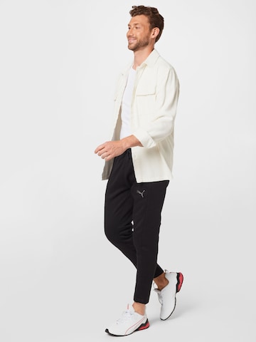 PUMA Tapered Sportbroek in Zwart