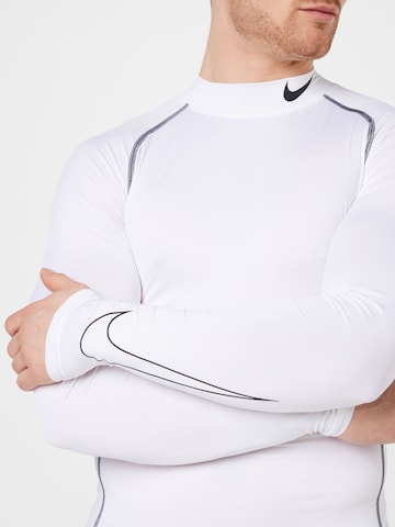 NIKE - Camiseta funcional en blanco