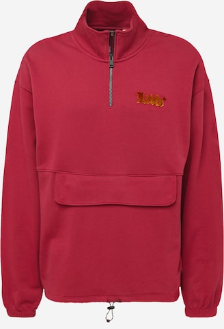 LEVI'S ® Sweatshirt 'RLXD Graphic 1/4 Zip Pch' in Rood: voorkant