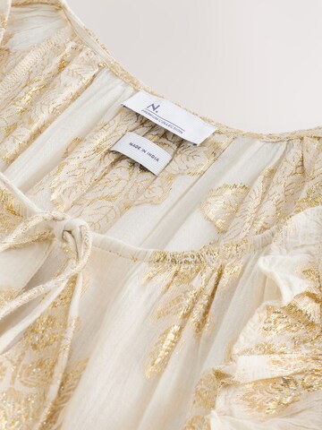 Next Klänning i beige